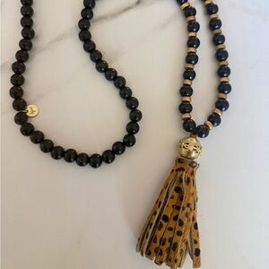 Elegant Black and Gold Beaded Necklace with Leopard Tassel
